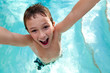 Joyful kid in a swimming pool.
