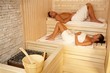 Couple lying in sauna