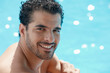 young man sitting in swimming pool