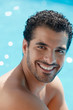 young man sitting in swimming pool