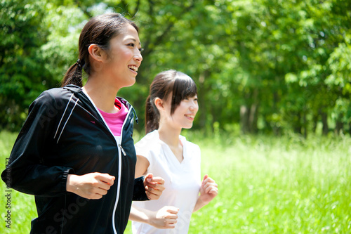 Photo: beautiful asian women jogging in the park beautiful asian women jogging in the park