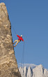 Rock climber rappelling.