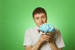 Lover man "nerd" with a bouquet of flowers