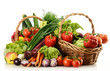 Composition with raw vegetables and wicker basket Composition with raw vegetables and wicker basket