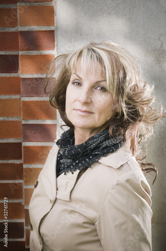 Photo: portrait of woman by the wall portrait of woman by the wall
