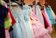 a rack of clothes for children, hanged