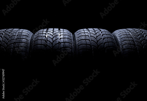 Photo: Car tires isolated on black background Car tires isolated on black background