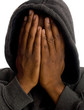African American man in sweatshirt covering face with hands African American man in sweatshirt covering face with hands