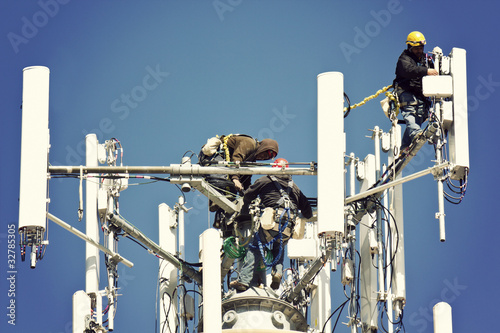 Photo: Crew installing antennas Crew installing antennas