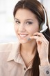 Photo: Attractive customer servicer smiling Attractive customer servicer smiling