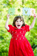 Happy little girl holdind-up words love