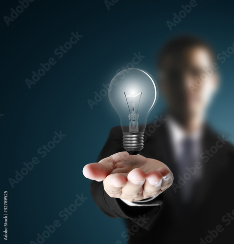 Photo: Light bulb in hand Light bulb in hand