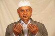 hands with muslim prayer beads