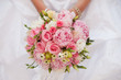 Photo: Bride with bouquet, closeup Bride with bouquet, closeup