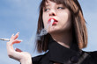 young elegant girl smoking a cigarette