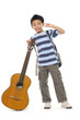 Little boy playing acoustic guitar - isolated