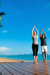 Yoga Couple By Ocean
