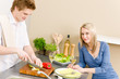 Lunch happy couple prepare salad in kitchen