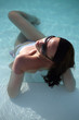 Foto: Young beautiful woman in the pool Young beautiful woman in the pool