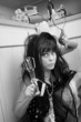 Woman Holds an Egg Beater and Masher