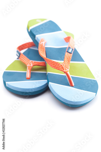 Photo: beautiful beach slippers isolated on white beautiful beach slippers isolated on white