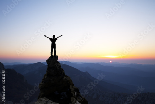 Foto: Man on the top of the rock Man on the top of the rock