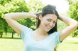 happy young woman enjoying on beautiful spring day in park