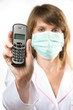 Female doctor holding telephone