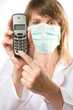 Female doctor holding telephone