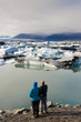 Couple in love. In background Jokulsarlon lagoon - Iceland.