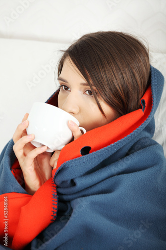 Photo: Young woman caught cold. Young woman caught cold.