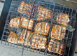 grilled pieces of fish on the grill