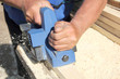Blue plane on a board and hands