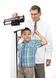 Little Boy Flexing Muscles at the Doctor's Office