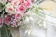 Wedding bouquet of roses and pearl necklace.
