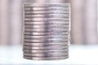 Silver coins stacks on white