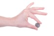 One Euro coin in female hand isolated