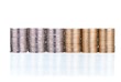 Silver and golden coins stacks on white