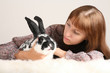 woman takes care of an experimental animal which has fear