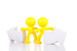 toy little men stand near the arrows specifying a direction.