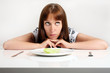 Portrait of a young woman who makes diet and has Hunger