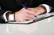 Young businessman at working and signing a contract