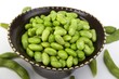 Edamame soy beans in a brown ceramic dish
