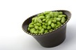 Edamame soy beans in a brown ceramic dish