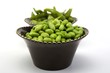 Edamame soy beans in a brown ceramic dish