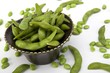 Edamame soy beans in a brown ceramic dish