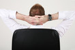 relaxation of the businessman in a chef’s chair - back view
