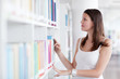 close-up portrait of a pretty female college student in library