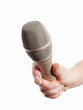Woman's hand holding microphone - isolated