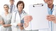 Closeup of blank clipboard held by doctor